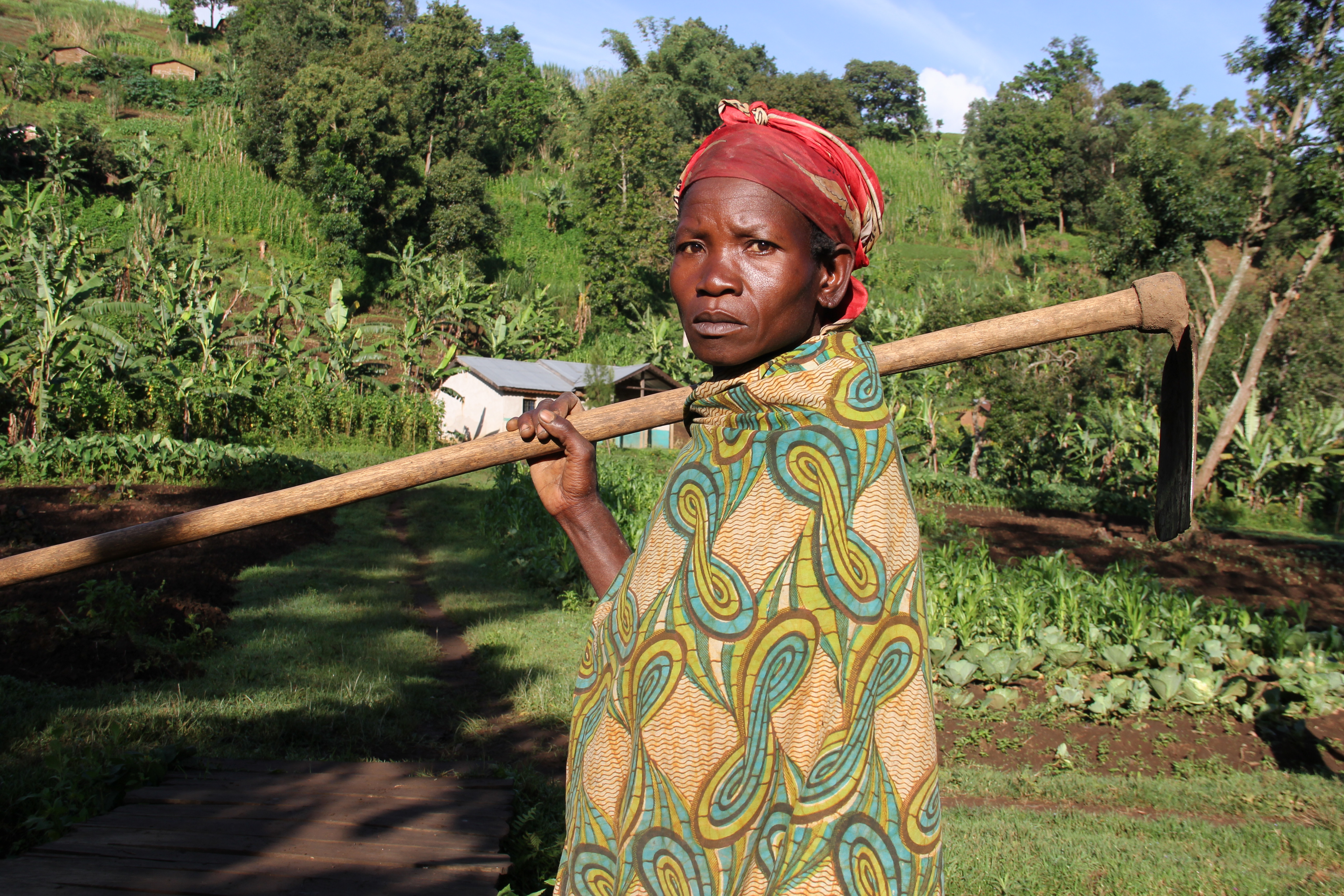 Congolese farmer in front of her crops.