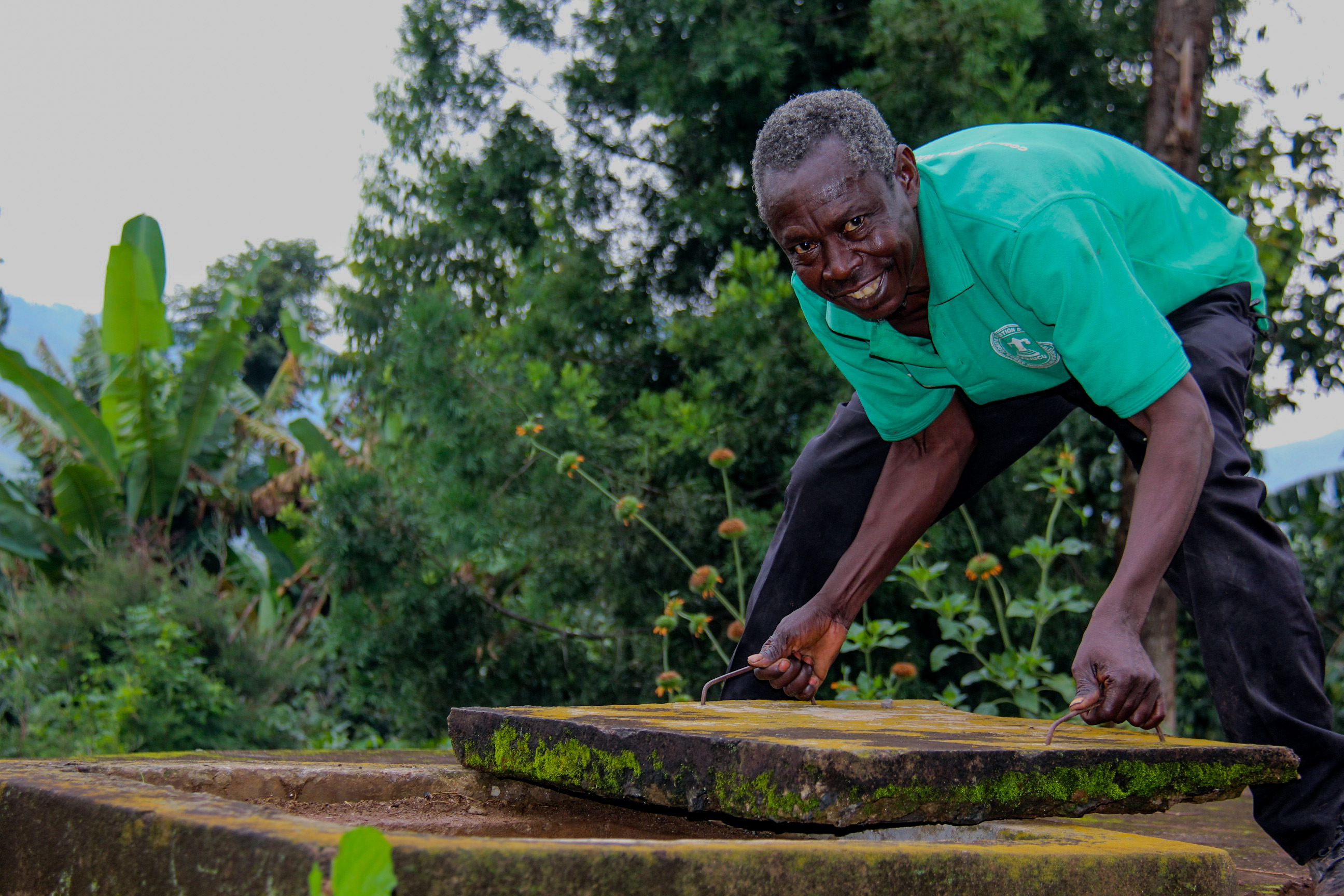 A person performing maintenance work on a reservoir.