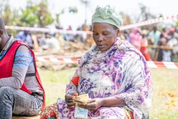 A person counting cash money.