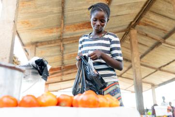 A person shopping for produce.