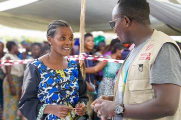Mercy corps employee interacts with drc individual.