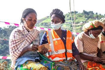 DRC individuals during cash assistance program event.