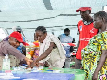 People working in an aid tent in drc