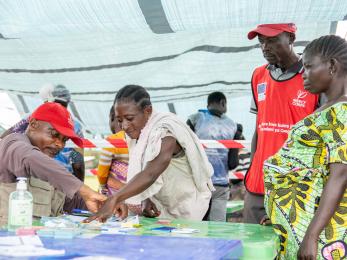 People working in an aid tent in DRC
