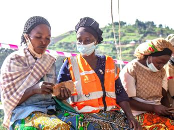 DRC individuals during cash assistance program event.